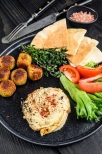 Hummus Salad with Falafel, Vegetables and Microgreens