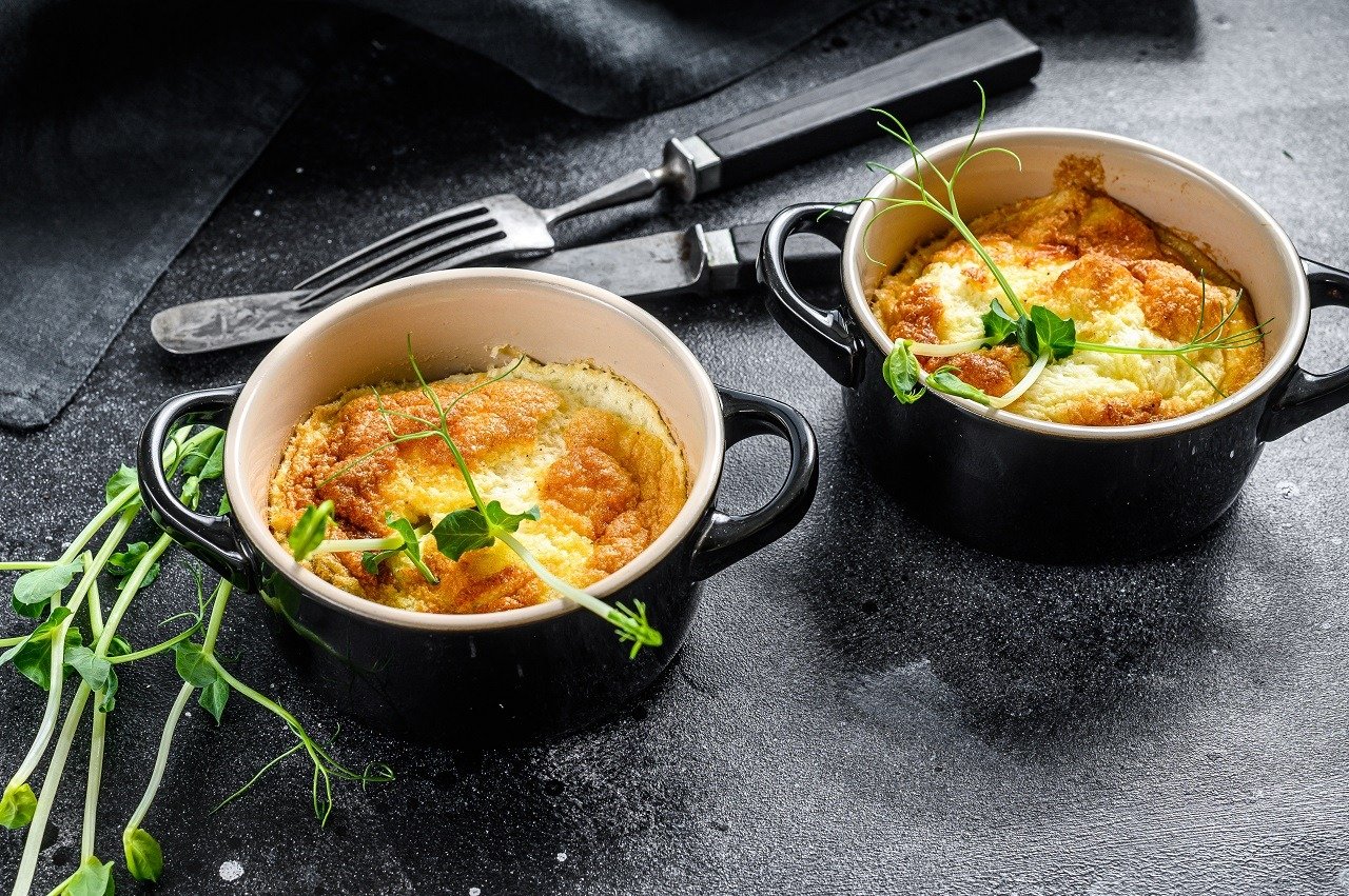 Cheese omelet with microgreens in a pan