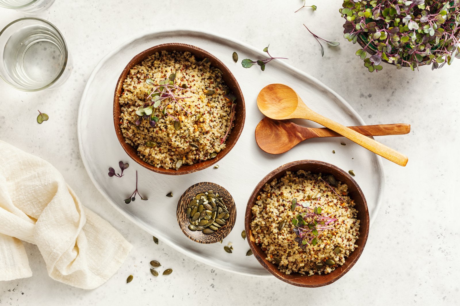 Healthy quinoa bowls with micro greens and pumpkin seeds. Healthy quinoa bowls with microgreens and pumpkin seeds.