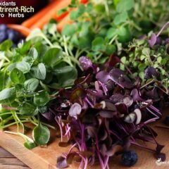 a vibrant, close-up shot of a wooden cutting board filled with an array of colorful micro herbs.
