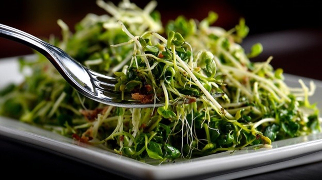 A vibrant array of cruciferous microgreens—tender broccoli, radish, and kale sprouts—cascades across a white ceramic plate. Beside them sits a simple anatomical illustration of the human throat highlighting the thyroid gland.